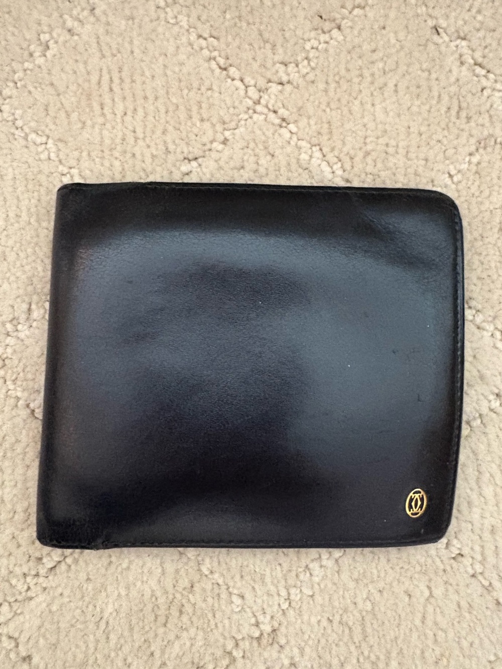 Cartier Black Leather Bi-Fold Card Holder with Gold Emblem